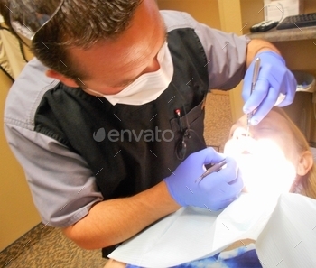 t, Chris, is performing my dental cleaning and flossing, after a complete set of tooth X-rays.  Perfect check up!