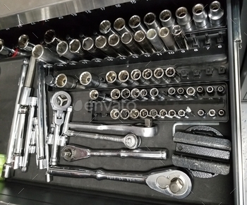 awer full of socket wrenches and sockets of various sizes. Tools come in Standard sizes for American made vehicles, and Metric sizes for Foreign made vehicles. Each performs a separate action based on the tool needed for the corresponding bolt head.