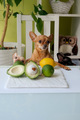 Dogs with green avocado with stone and lime at the table in the kitchen - PhotoDune Item for Sale