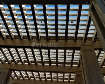 urban structure, looking through the geometric shapes at the sky above. The lattice work shape of modern architecture.