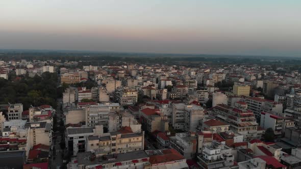 aerial view of compact building in urban karditsa with the beautiful yellow sky (11)