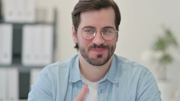 Portrait of Young Man Showing Thumbs Up Sign