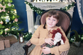 Cute little girl under Christmas tree with gift boxes. New Year's decorations. - PhotoDune Item for Sale