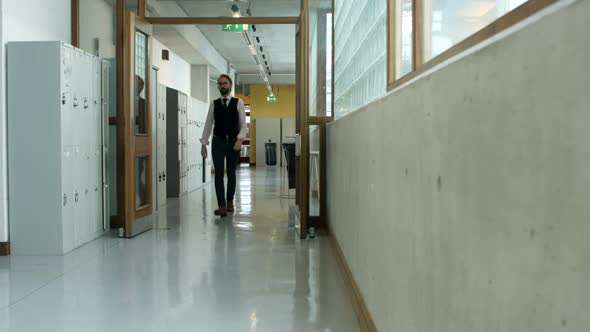 Male executive walking in corridor 4k