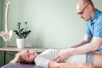 a female patient, rib cage release massage, breathing muscle relaxation