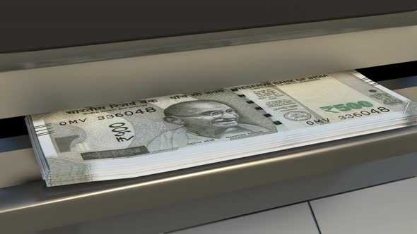 500 Indian rupees  in cash dispenser. Withdrawal of cash from an ATM.