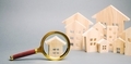 Magnifying glass and wooden houses - PhotoDune Item for Sale