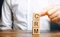 Wooden blocks with the word CRM (Customer Relationship Management) and businessman - PhotoDune Item for Sale