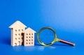 figures of residential buildings and magnifying glass - PhotoDune Item for Sale