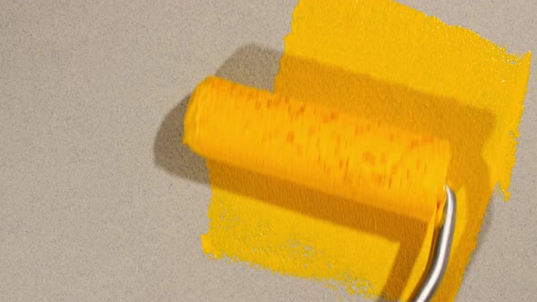 Yellow Acrylic Paint on a Gray Background