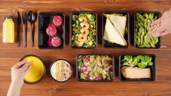 Food Delivery Top View Take Away Meals in Disposable Containers on Wooden Table