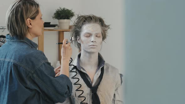 Professional SFX Artist Putting Scary Makeup on Man