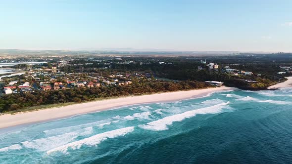 Drone panning over Lighthouse Beach, Ballina Township and Richmond river mouth.