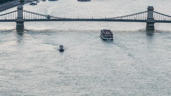 Ships Sailing Under Freedom Bridge in Budapest, Hungary. Day to Night Timelapse