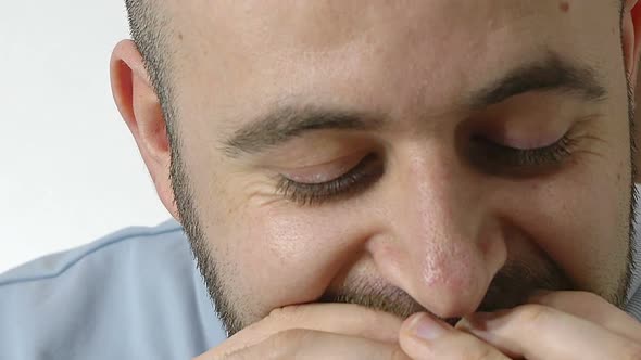 closeup portrait of young man eating a hamburger