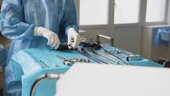 A Table of Medical Tools are Placed Upon a Table in Preparation for Robotic