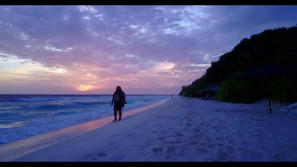 Woman enjoys life on paradise island beach adventure by transparent sea with white sand background o