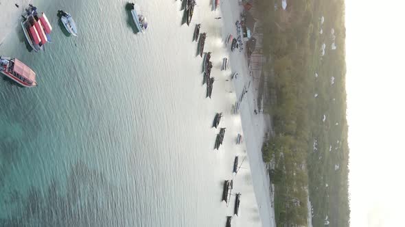 Vertical Video Boats in the Ocean Near the Coast of Zanzibar Tanzania Aerial View