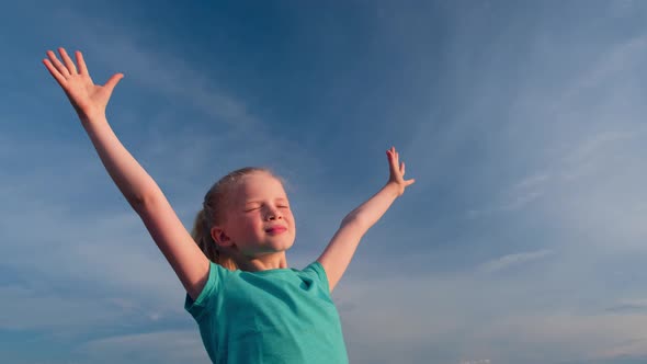 Relaxed Girl Breathing Fresh Air Raising Arms Over Blue Sky at Summer