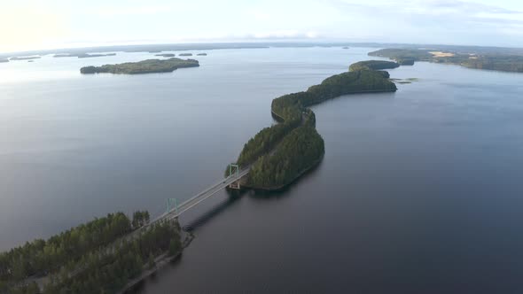 Aerial view of road going through narrow and long islands in Finland