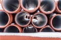 Large sectional sewer pipes covered with snow during winter construction - PhotoDune Item for Sale