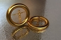 3D illustration of jewelry in the form of figures of people inside the gold rings on the water  - PhotoDune Item for Sale