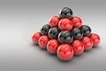 3D illustration, a pyramid of red and black balls on a blank background - PhotoDune Item for Sale