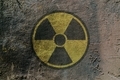 Sign of radioactive danger depicted on a concrete wall - PhotoDune Item for Sale