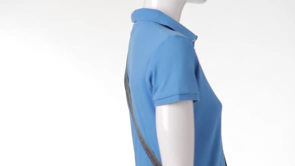 Rotating Mannequin in Blue T-shirt.