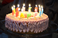 A simple birthday cake with candles lit - PhotoDune Item for Sale
