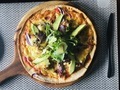 Overhead of pizza with lettuce and avocado on a wood plate  - PhotoDune Item for Sale