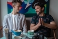 Father and son are talking and smiling in the coffee shop - PhotoDune Item for Sale