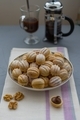 Sweets/cookies in the plate on the neutral background with coffee cup and plunger.  - PhotoDune Item for Sale