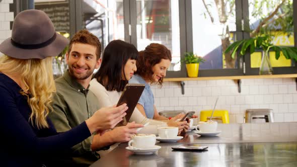 Executives using digital tablet at table 4k