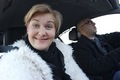 Mature woman sitting in the car and making selfie's. - PhotoDune Item for Sale