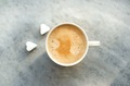 Coffee cup and two pieces of sugar in the heart shape on the grey background.  Top view. - PhotoDune Item for Sale