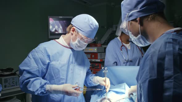 Group of Surgeons Performing Procedure