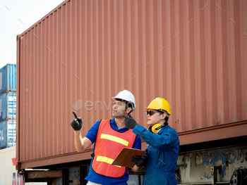 e red safety talk look report notebook tablet computer.Businessmen pointing finger hand work import export port terminal container company custom