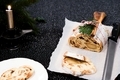 Traditional Christmas stollen with dried fruits, raisins and marzipan decorated with sugar powder - PhotoDune Item for Sale