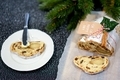 Traditional Christmas stollen with dried fruits, raisins and marzipan  decorated with sugar powder  - PhotoDune Item for Sale