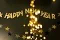 Golden text Happy New Year on the dark background - PhotoDune Item for Sale