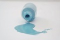 Light blue nail polish spilled on the white table. - PhotoDune Item for Sale