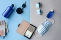 Travel items flat lay on blue and grey background - PhotoDune Item for Sale