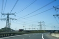 High-voltage electricity towers along the highway. - PhotoDune Item for Sale