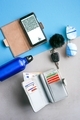Travel items flat lay on blue and grey background  - PhotoDune Item for Sale