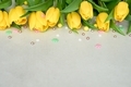 Easter yellow tulips with colored sprinkles on the white background - PhotoDune Item for Sale