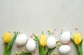 Easter yellow tulips with colored sprinkles on the white background - PhotoDune Item for Sale