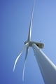 Windmill in the blue sky. Sustainable energy, wind energy. Windmil directly from beneath. - PhotoDune Item for Sale