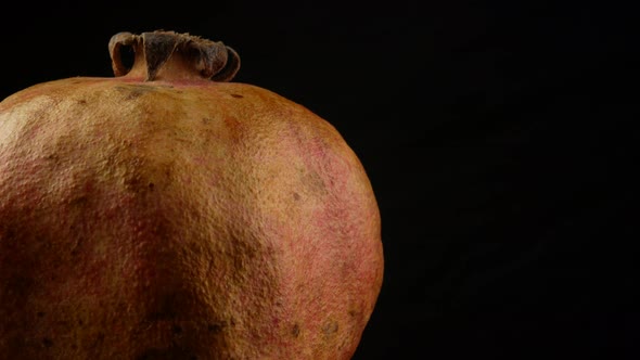 Pomegranate on black background