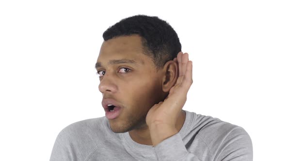 Young Handsome AfroAmerican Man Listening Secret White Background